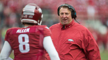 Nov 18, 2017; Fayetteville, AR, USA; Arkansas Razorbacks head coach Bret Bielema talks with quarterback Austin Allen (8) during a timeout in the fourth quarter of the game at Donald W. Reynolds Razorback Stadium. Mississippi State Bulldogs won the game 28-21. Mandatory Credit: Brett Rojo-USA TODAY Sports