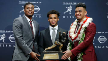 Dec 8, 2018; New York, NY, USA; Heisman Trophy finalists (left to right) Ohio State Buckeyes quarterback Dwayne Haskins and Oklahoma Sooners quarterback Kyler Murray and Alabama Crimson Tide quarterback Tua Tagovailoa pose with the Heisman Trophy during a press conference at the New York Marriott Marquis before the Heisman Trophy announcement ceremony. Mandatory Credit: Brad Penner-USA TODAY Sports