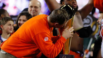TAMPA, FL - JANUARY 09: Head coach Dabo Swinney of the Clemson Tigers celebrates with the College Football Playoff National Championship Trophy after defeating the Alabama Crimson Tide 35-31 to win the 2017 College Football Playoff National Championship Game at Raymond James Stadium on January 9, 2017 in Tampa, Florida. (Photo by Kevin C. Cox/Getty Images)