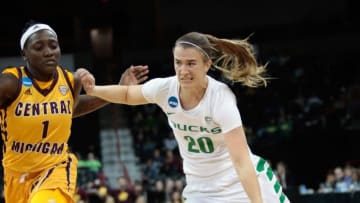 SPOKANE, WA - MARCH 24: Sabrina Ionescu #20 of the Oregon Ducks drives against Micaela Kelly #1 of the Central Michigan Chippewas during the 2018 NCAA Division 1 Women's Basketball Tournament at Spokane Veterans Memorial Arena on March 24, 2018 in Spokane, Washington. (Photo by William Mancebo/Getty Images)