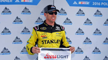 Aug 19, 2016; Bristol, TN, USA; NASCAR Sprint Cup Series driver Carl Edwards (19) after winning the pole during qualifying for the Bass Pro Shops NRA Night Race at Bristol Motor Speedway. Mandatory Credit: Randy Sartin-USA TODAY Sports