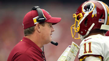 GLENDALE, AZ - SEPTEMBER 9: Head coach Jay Gruden talks with quarterback Alex Smith #11 of the Washington Redskins during the third quarter against the Arizona Cardinals at State Farm Stadium on September 9, 2018 in Glendale, Arizona. (Photo by Christian Petersen/Getty Images)