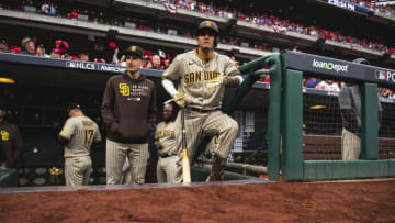 PHILADELPHIA, PENNSYLVANIA - OCTOBER 23: Manny Machado #13 of the San Diego Padres stands in the dugout before the start of Game Five of the National League Championship Series against the Philadelphia Phillies at Citizens Bank Park on October 23, 2022 in Philadelphia, Pennsylvania. (Photo by Matt Thomas/San Diego Padres/Getty Images)