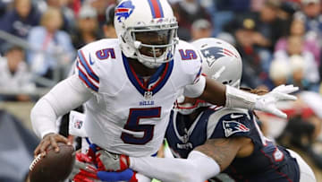 Oct 2, 2016; Foxborough, MA, USA; Buffalo Bills quarterback Tyrod Taylor (5) tries to break free from New England Patriots defensive end Jabaal Sheard (93) during the second half of the Buffalo Bills 16-0 win over the New England Patriots at Gillette Stadium. Mandatory Credit: Winslow Townson-USA TODAY Sports