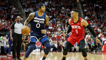 D'Angelo Russell of the Minnesota Timberwolves dribbles the ball while defended by Russell Westbrook #0 of the Houston Rockets. (Photo by Tim Warner/Getty Images)