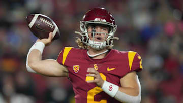 Nov 27, 2021; Los Angeles, California, USA; Southern California Trojans quarterback Jaxson Dart (2) throws the ball against the BYU Cougars in the first half at United Airlines Field at Los Angeles Memorial Coliseum. Mandatory Credit: Kirby Lee-USA TODAY Sports