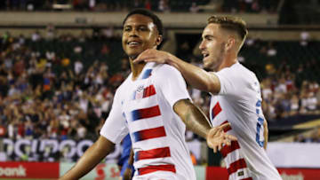 USA's Tyler Boyd (R) embraces teammate Weston McKennie after McKennie scored a goal in the first half during the CONCACAF Gold Cup quarterfinal football match between USA and Curacao in Philadelphia, Pennsylvania, on June 30, 2019. (Photo by DOMINICK REUTER / AFP) (Photo credit should read DOMINICK REUTER/AFP/Getty Images)