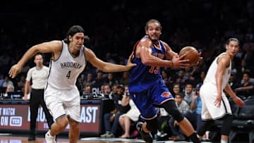 Oct 20, 2016; Brooklyn, NY, USA; New York Knicks center Joakim Noah (13) drives to the basket against Brooklyn Nets forward Luis Scola (4) during first half at Barclays Center. Mandatory Credit: Noah K. Murray-USA TODAY Sports