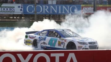 Aug 10, 2014; Watkins Glen, NY, USA; NASCAR Sprint Cup Series driver AJ Allmendinger (47) celebrates a win during the Cheez-It 355 at Watkins Glen International. Mandatory Credit: Timothy T. Ludwig-USA TODAY Sports