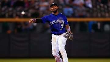 Sep 3, 2015; Denver, CO, USA; Colorado Rockies shortstop Jose Reyes (7) throws to first in the eighth inning against the San Francisco Giants at Coors Field. The Rockies defeated the Giants 11-3. Mandatory Credit: Isaiah J. Downing-USA TODAY Sports