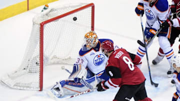 Mar 22, 2016; Glendale, AZ, USA; Arizona Coyotes center Tobias Rieder (8) scores on Edmonton Oilers goalie Cam Talbot (33) during the second period at Gila River Arena. Mandatory Credit: Matt Kartozian-USA TODAY Sports