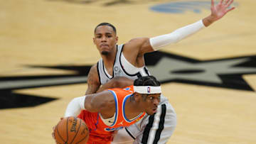OKC Thunder guard Shai Gilgeous-Alexander (2) dribbles past Spurs guard Dejounte Murray (5) : Daniel Dunn-USA TODAY Sports
