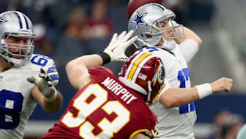 ARLINGTON, TX - JANUARY 03: Kellen Moore #17 of the Dallas Cowboys looks for an open receiver Trent Murphy #93 of the Washington Redskins in the fourth quarter at AT&T Stadium on January 3, 2016 in Arlington, Texas. (Photo by Tom Pennington/Getty Images)