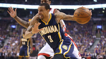 Apr 18, 2016; Toronto, Ontario, CAN; Indiana Pacers guard George Hill (3) drives to the basket against Toronto Raptors guard DeMar DeRozan (10) in game two of the first round of the 2016 NBA Playoffs at Air Canada Centre. The Raptors beat the Pacers 98-87. Mandatory Credit: Tom Szczerbowski-USA TODAY Sports