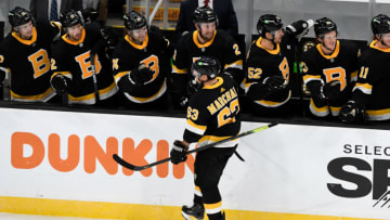 Jan 26, 2021; Boston, Massachusetts, USA; Boston Bruins center Brad Marchand (63) celebrates with teammates after scoring against the Pittsburgh Penguins during the first period at the TD Garden. Mandatory Credit: Brian Fluharty-USA TODAY Sports