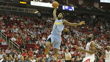 Oct 28, 2015; Houston, TX, USA; Denver Nuggets guard Will Barton (5) dunks against Houston Rockets guard James Harden (13) and guard Ty Lawson (3) in the second half on opening night at Toyota Center. Denver won 105 to 85. Mandatory Credit: Thomas B. Shea-USA TODAY Sports