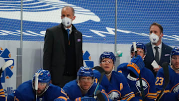 BUFFALO, NY - MARCH 18: Buffalo Sabres interim head coach Don Granato (left) and Buffalo Sabres director of player development Matt Ellis behind the bench for their first game in these positions during the first period against the Boston Bruins at KeyBank Center on March 18, 2021 in Buffalo, New York. (Photo by Kevin Hoffman/Getty Images)
