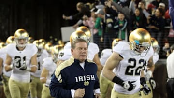 STANFORD, CA - NOVEMBER 26: Notre Dame Fighting Irish head coach Brian Kelly run on to the field for their game against the Stanford Cardinal at Stanford Stadium on November 26, 2011 in Stanford, California. (Photo by Ezra Shaw/Getty Images)