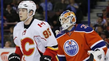 Jan 16, 2016; Edmonton, Alberta, CAN; Calgary Flames forward Sam Bennett (93) tries to screen Edmonton Oilers goaltender Cam Talbot (33) during the first period at Rexall Place. Mandatory Credit: Perry Nelson-USA TODAY Sports