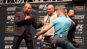 Dec 9, 2015; Las Vegas, NV, USA; Jose Aldo and Conor McGregor face off after the press conference ahead of their bout at UFC 194 at the MGM Grand Garden Arena. Mandatory Credit: Mike Dyce-FanSided