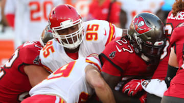 Nov 29, 2020; Tampa, Florida, USA; Tampa Bay Buccaneers running back Ronald Jones (27) runs the ball as Kansas City Chiefs defensive tackle Chris Jones (95) moves in for the tackle during the first half at Raymond James Stadium. Mandatory Credit: Kim Klement-USA TODAY Sports