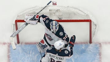 SUNRISE, FL - DECEMBER 13: Kirill Marchenko #86 consoles goaltender Elvis Merzlikins #90 of the Columbus Blue Jackets after the 4-0 loss to the Florida Panthers at the FLA Live Arena on December 13, 2022 in Sunrise, Florida. (Photo by Joel Auerbach/Getty Images)