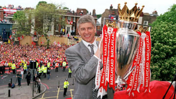 LONDON, ENGLAND - MAY 19: Arsenal manager Arsene Wenger holds the Premier League trophy at Islington Town Hall on May 19, 2004 in London, England. (Photo by Stuart MacFarlane/Arsenal FC via Getty Images)