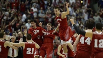 Mar 29, 2014; Anaheim, CA, USA; Wisconsin Badgers players celebrate after overtime in the finals of the west regional of the 2014 NCAA Mens Basketball Championship tournament against the Arizona Wildcats at Honda Center. The Badgers defeated the Wildcats 64-63. Mandatory Credit: Richard Mackson-USA TODAY Sports