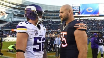 Nov 1, 2015; Chicago, IL, USA; Chicago Bears offensive tackle Kyle Long (75) talks to Minnesota Vikings outside linebacker Chad Greenway (52) after their game at Soldier Field. The Vikings won 23-20. Mandatory Credit: Mike DiNovo-USA TODAY Sports