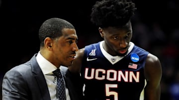 Mar 19, 2016; Des Moines, IA, USA; Connecticut Huskies head coach Kevin Ollie talks to guard Daniel Hamilton (5) in the first half against the Kansas Jayhawks during the second round of the 2016 NCAA Tournament at Wells Fargo Arena. Mandatory Credit: Jeffrey Becker-USA TODAY Sports