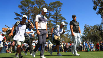 PONTE VEDRA BEACH, FLORIDA - MARCH 12: Rory McIlroy of Northern Ireland walks off the sixth tee with Brooks Koepka of the United States during the first round of The PLAYERS Championship on The Stadium Course at TPC Sawgrass on March 12, 2020 in Ponte Vedra Beach, Florida. (Photo by Mike Ehrmann/Getty Images)