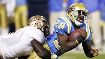 SAN FRANCISCO - DECEMBER 27: Matt Caldwell #28 of the UCLA Bruins is tackled during the 2006 Emerald Bowl against the Florida State Seminoles December 27, 2006 at AT&T Park in San Francisco, California. (Photo by Justin Sullivan/Getty Images)