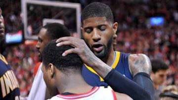 May 1, 2016; Toronto, Ontario, CAN; Indiana Pacers forward Paul George (13) congratulates Toronto Raptors guard Kyle Lowry (7) after the Raptors won game seven of the first round of the 2016 NBA Playoffs 89-84 at Air Canada Centre. Mandatory Credit: Dan Hamilton-USA TODAY Sports