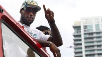 Jun 24, 2013; Miami, FL, USA; Miami Heat small forward LeBron James rides through downtown Miami during the Heat Championship celebration parade. Mandatory Credit: Robert Mayer-USA TODAY Sports