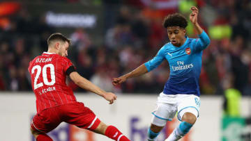 COLOGNE, GERMANY - NOVEMBER 23: Salih Oezcan of FC Koeln and Reiss Nelson of Arsenal battle for possession during the UEFA Europa League group H match between 1. FC Koeln and Arsenal FC at RheinEnergieStadion on November 23, 2017 in Cologne, Germany. (Photo by Dean Mouhtaropoulos/Getty Images)