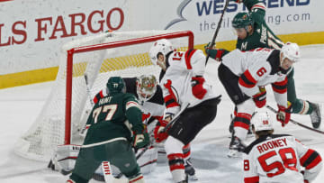 ST. PAUL, MN - FEBRUARY 15: Brad Hunt #77 of the Minnesota Wild beats Keith Kinkaid #1 of the New Jersey Devils on this shot for a 1st period power play goal as Ben Lovejoy #12 of the New Jersey Devils defends during a game at Xcel Energy Center on February 15, 2019 in St. Paul, Minnesota.(Photo by Bruce Kluckhohn/NHLI via Getty Images)