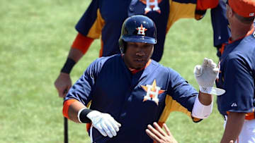 Mar 28, 2013; Kissimmee, FL, USA; Houston Astros first baseman Jonathan Singleton (14) celebrates after hitting his second home run of the game during the third inning against the Detroit Tigers at Osceola County Stadium. Mandatory Credit: Douglas Jones-USA TODAY Sports