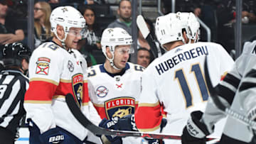 LOS ANGELES, CA - MARCH 16: Evgenii Dadonov #63 of the Florida Panthers, center, celebrates his second-period goal with Aleksander Barkov #16 and Jonathan Huberdeau #11 during the game against the Los Angeles Kings at STAPLES Center on March 16, 2019 in Los Angeles, California. It was Dadonov's 200th NHL career game. (Photo by Adam Pantozzi/NHLI via Getty Images)