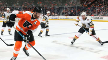 PHILADELPHIA, PA - OCTOBER 21: Sean Couturier #14 of the Philadelphia Flyers skates the puck against Paul Stastny #26 of the Vegas Golden Knights on October 21, 2019 at the Wells Fargo Center in Philadelphia, Pennsylvania. (Photo by Len Redkoles/NHLI via Getty Images)