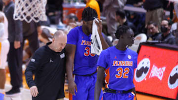 Jan 26, 2022; Knoxville, Tennessee, USA; Florida Gators center Jason Jitoboh (33) is helped off court after an injury during the first half against the Tennessee Volunteers at Thompson-Boling Arena. Mandatory Credit: Randy Sartin-USA TODAY Sports
