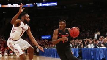 NEW YORK, NY - MARCH 31: Deandre Burnett #1 of the Miami (Fl) Hurricanes drives by Josh Brown #1 of the Temple Owls during the NIT Championship semifinals at Madison Square Garden on March 31, 2015 in New York City. (Photo by Jeff Zelevansky/Getty Images)