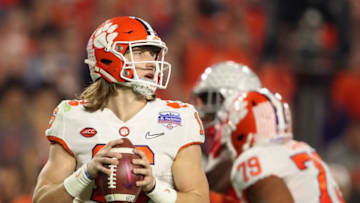 GLENDALE, ARIZONA - DECEMBER 28: Quarterback Trevor Lawrence #16 of the Clemson Tigers drops back to pass during the PlayStation Fiesta Bowl against the Ohio State Buckeyes at State Farm Stadium on December 28, 2019 in Glendale, Arizona. The Tigers defeated the Buckeyes 29-23. (Photo by Christian Petersen/Getty Images)