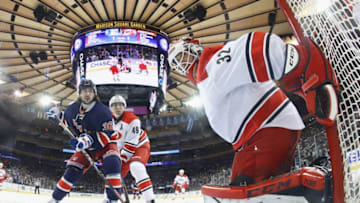 NEW YORK, NY - DECEMBER 03: Victor Rask #49 and Michael Leighton #32 of the Carolina Hurricanes defend against Mats Zuccarello #36 of the New York Rangers at Madison Square Garden on December 3, 2016 in New York City. The Rangers defeated the Hurricanes 4-2. (Photo by Bruce Bennett/Getty Images)