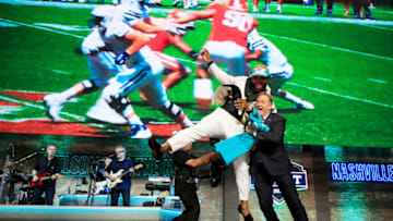 NASHVILLE, TENNESSEE - APRIL 25: Christian Wilkins of Clemson celebrates with NFL Commissioner Roger Goodell after being chosen #13 overall by the Miami Dolphins during the first round of the 2019 NFL Draft on April 25, 2019 in Nashville, Tennessee. (Photo by Andy Lyons/Getty Images)