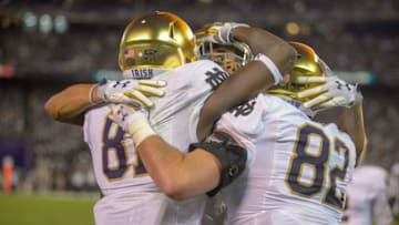 SAN DIEGO, CA - OCTOBER 27: Miles Boykin #81, with Nic Weishar #82 and Chase Claypool #83, of the Notre Dame Fighting Irish celebrate after scoring a touchdown in the 1st half against the Navy Midshipmen at SDCCU Stadium on October 27, 2018 in San Diego, California. (Photo by Kent Horner/Getty Images)