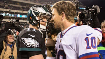 Dec 22, 2016; Philadelphia, PA, USA; Philadelphia Eagles quarterback Carson Wentz (11) and New York Giants quarterback Eli Manning (10) meet on the field after the game at Lincoln Financial Field. The Philadelphia Eagles won 24-19. Mandatory Credit: Bill Streicher-USA TODAY Sports