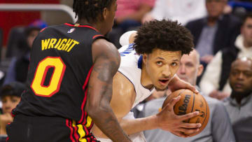Mar 7, 2022; Detroit, Michigan, USA; Detroit Pistons guard Cade Cunningham (2) gets defended by Atlanta Hawks guard Delon Wright (0) during the third quarter at Little Caesars Arena. Mandatory Credit: Raj Mehta-USA TODAY Sports