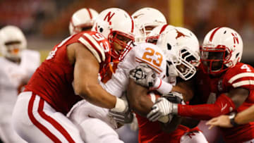 Nebraska's Ndamukong Suh (93) and Larry Asante (4) tackle Texas's Tre' Newton (23) during Big 12 Championship Game at Cowboys Stadium in Arlington, Texas, Saturday, December 5, 2009. (Photo by Richard W. Rodriguez/Fort Worth Star-Telegram/Tribune News Service via Getty Images)