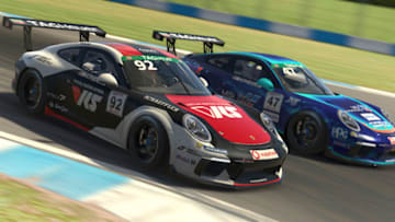 DONNINGTON, ENGLAND - MAY 23: (EDITORIAL USE ONLY) (Editors note: This image was computer generated in-game) Joshua Rogers of Australia and VRS Coanda Simport passes Alejandro Sanchez of Spain and MSI eSports for second position during the feature race in Round Three of the Porsche TAG Heuer Esports Supercup run at Donnington Park on May 23, 2020 in Donnington, United Kingdom. (Photo by Clive Rose/Getty Images)