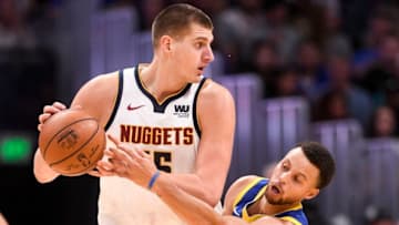 DENVER, CO - OCTOBER 21: Stephen Curry (30) of the Golden State Warriors attempts to defend Nikola Jokic (15) of the Denver Nuggets during the second half of the Nuggets' 100-98 win on Sunday, October 21, 2018. The Denver Nuggets hosted the Golden State Warriors at the Pepsi Center in Denver. (Photo by AAron Ontiveroz/The Denver Post via Getty Images)